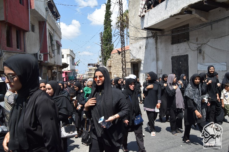 متابعة مسيرة حسينية حاشدة لحركة أمل في معركة إحياءً لمراسم العاشر من محرم. 