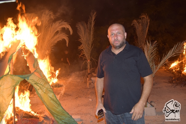 بالصور:تجسيد واقعة حرق الخيام في مضيف  سيد الشهداء(ع) في ساحة بلدة معركة